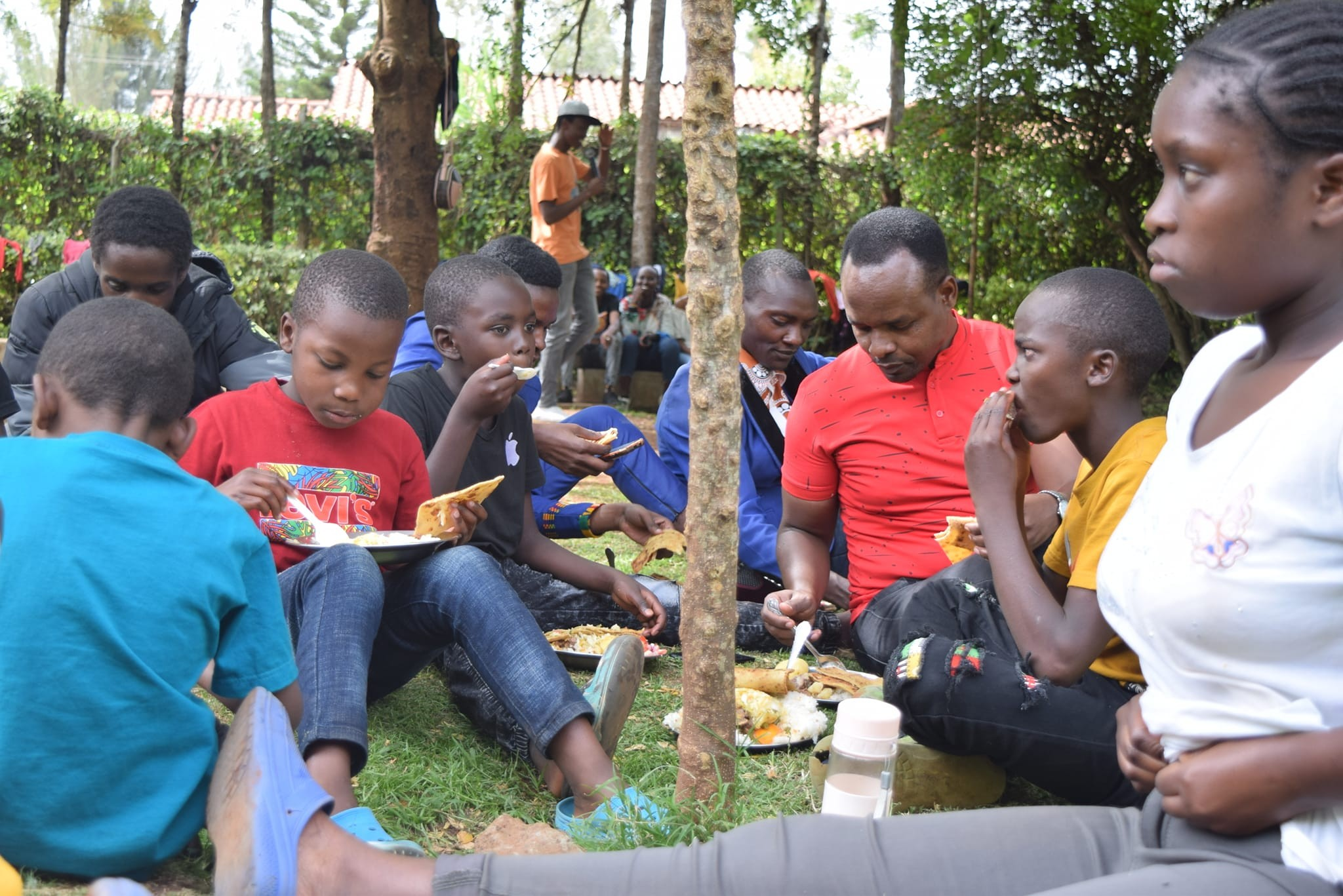 Children sharing a meal during a DKF outreach